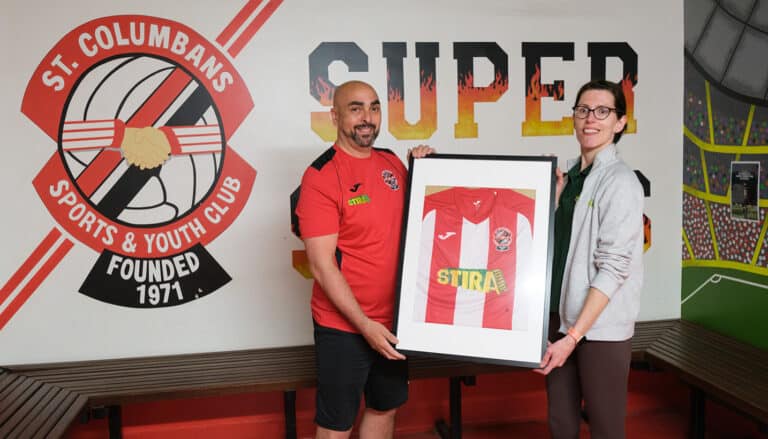 Columbans Jersey being gifted to Kate Rogers from Stira.